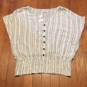 White with black striped V-neck shirt